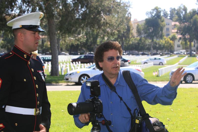 Producer Randy Bellous and a member of the USMC, volunteering as a photographer for the Memorial Day Event at the Los Angeles National Cemetery.