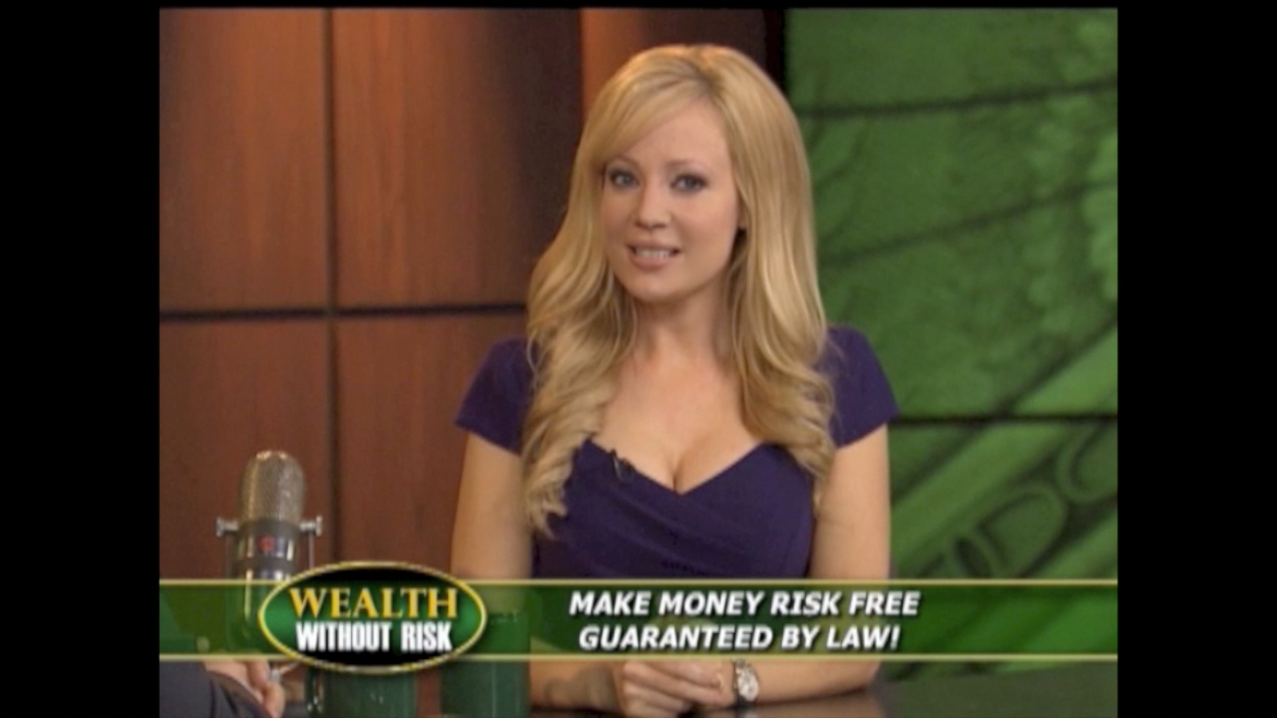 Screen grab of host Stacey Hayes on set of infomercial WEALTH WITHOUT RISK