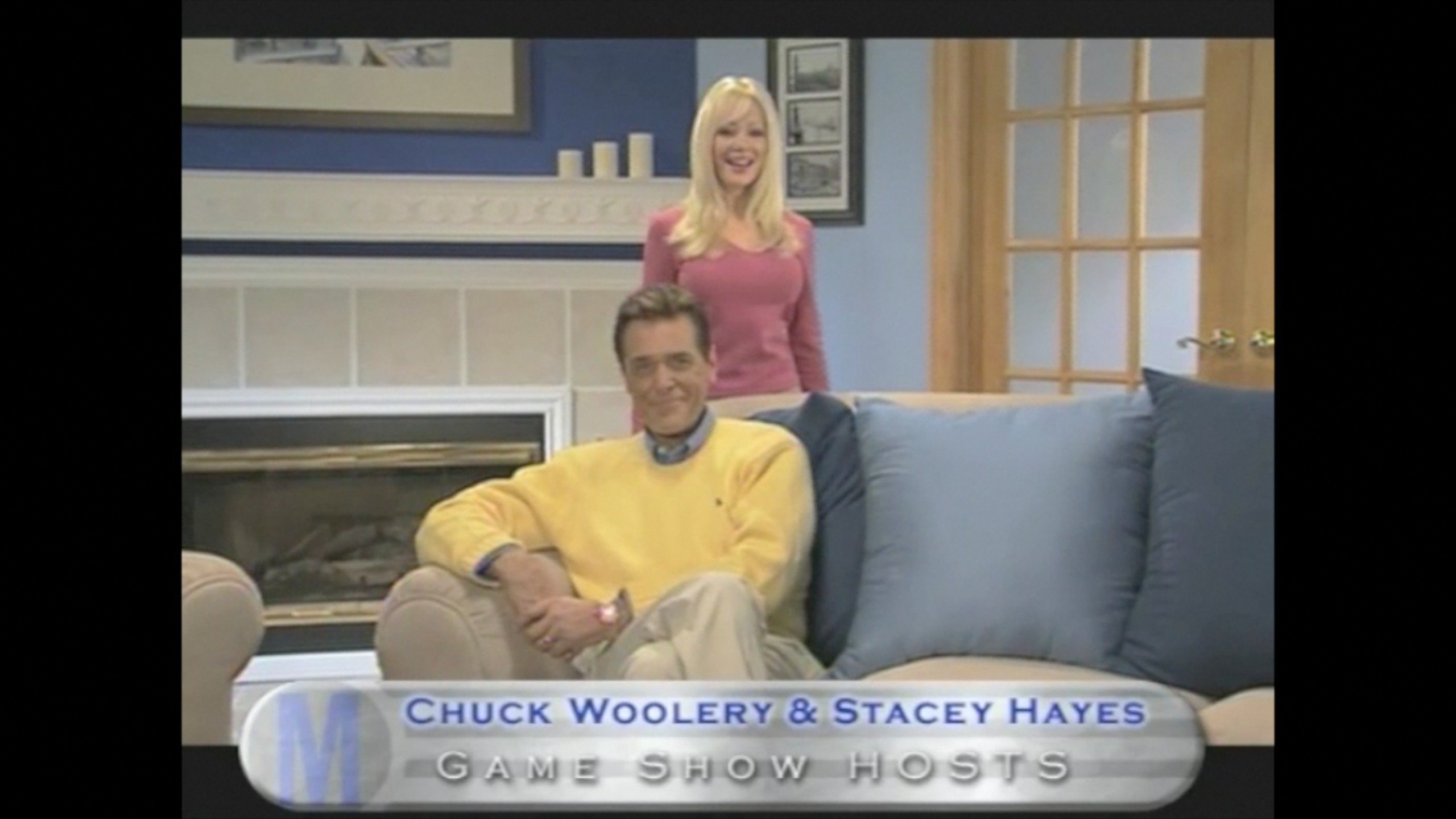 Commercial screen grab of Co Hosts Chuck Woolery and Stacey Hayes from the Game Show Network Show, 