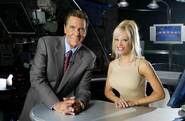 Co Hosts of the Game Show Network Show, Lingo Chuck Woloery and Stacey Hayes pose on set