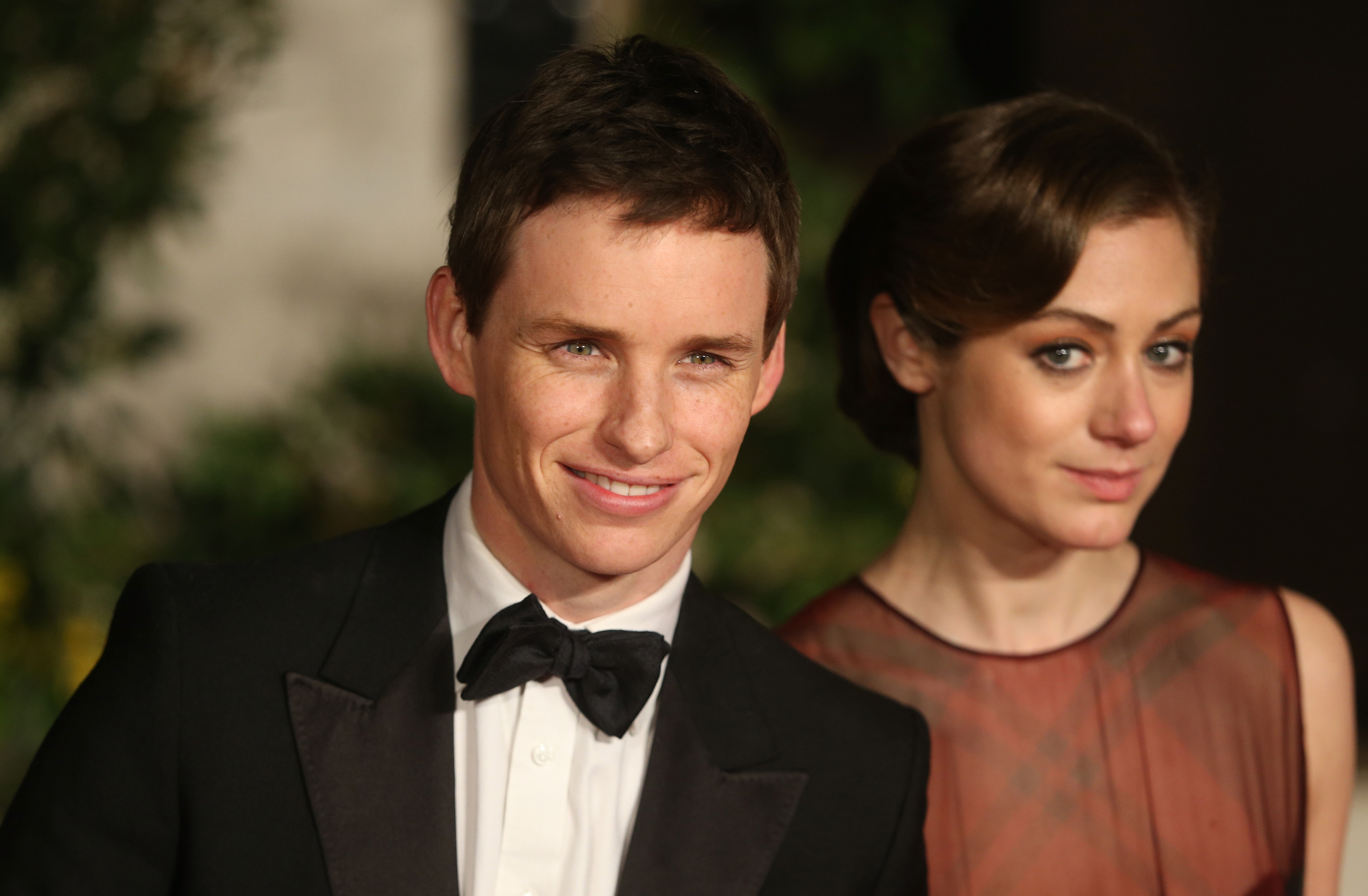 Eddie Redmayne and Hannah Bagshawe arrive for an official dinner party after the EE British Academy Film Awards at The Grosvenor House Hotel on February 16, 2014 in London, England.
