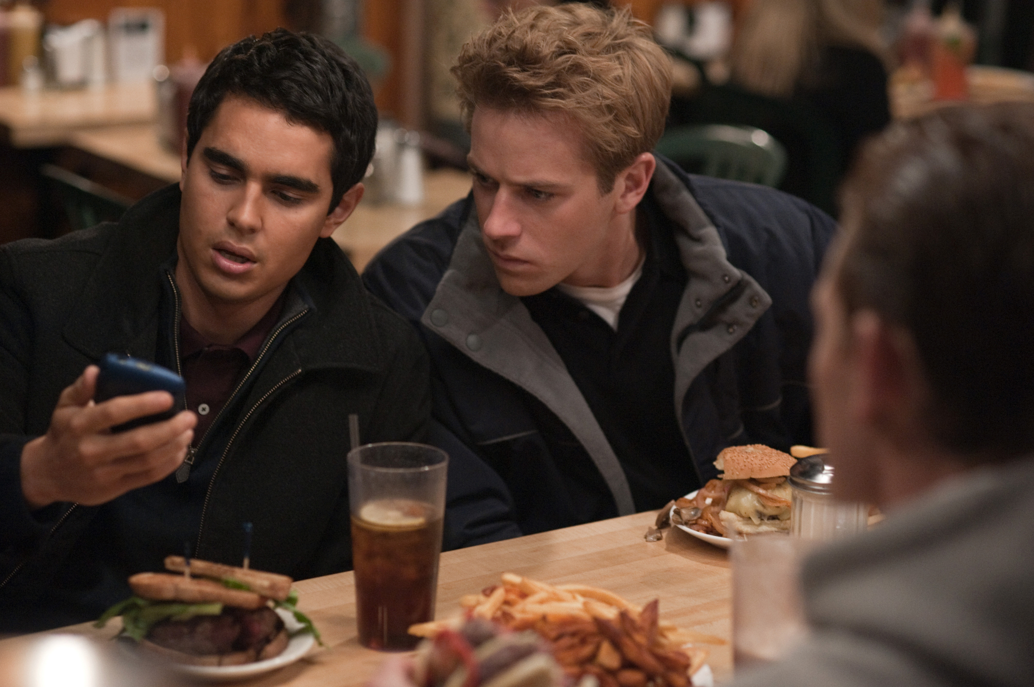 Still of Jesse Eisenberg, Max Minghella and Armie Hammer in The Social Network (2010)