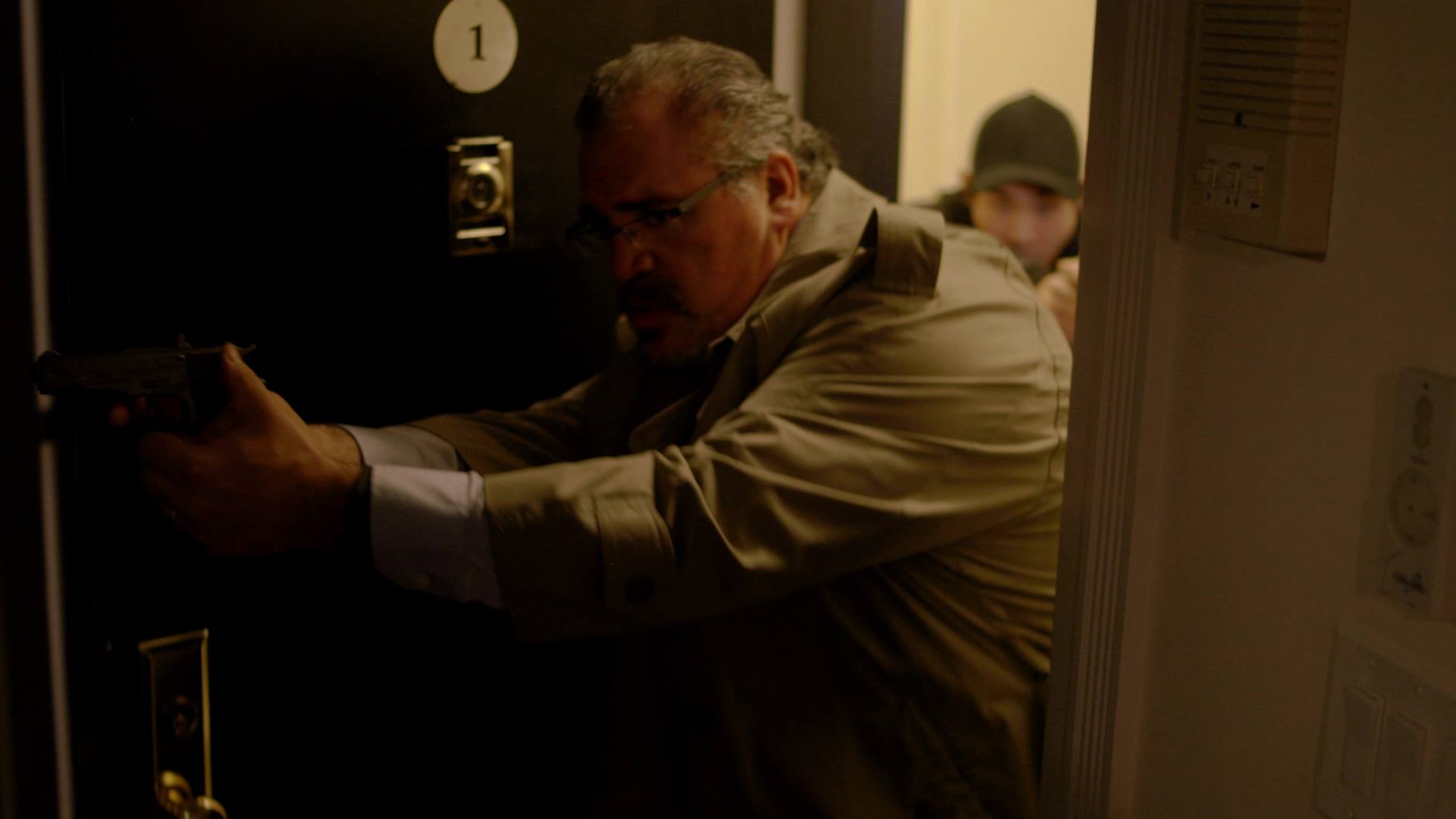 Detective Hendry breaking down the door in 