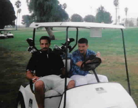 Enjoying his favorite pastime, Carlo with friend Dennis relax on a southern California course.