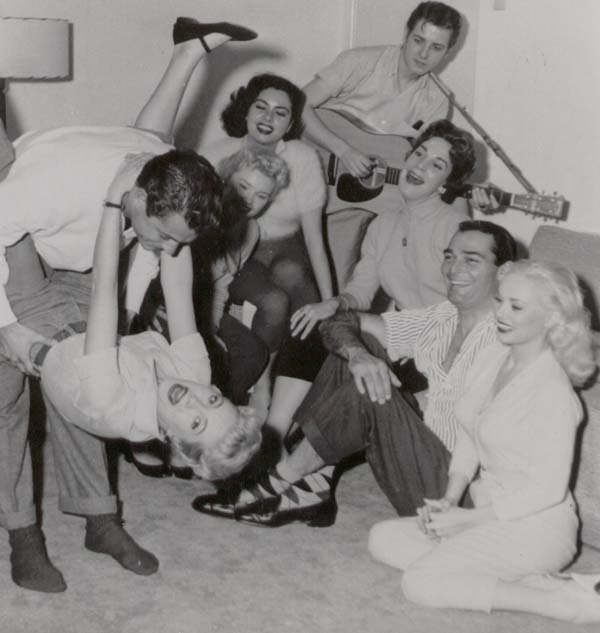 JEANNE CARMEN [dark hair, back row] & Rockabilly Legend & Rock N Roll Hall of Famer EDDIE COCHRAN [back row with guitar in hand] party after hours on the set of UNTAMED YOUTH