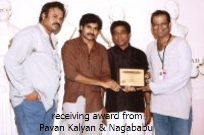 receiving award from Pavan Kalyan & Nagababu