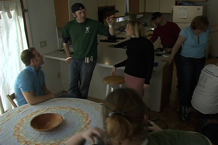 Writer/Director Shane Tilston (center left) talks with lead actors Lindsay Doleshal (center) and Kit Wannen (left) between takes.