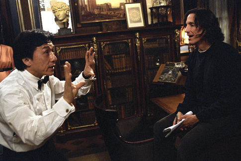 JACKIE CHAN (left) goes over a scene with director KEVIN DONOVAN