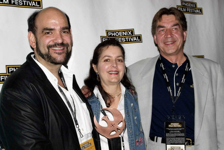 Ricardo Méndez Matta and Poli Marichal receive the Best Director award from Slobodan Popovic at the 2006 Phoenix Film Festival.