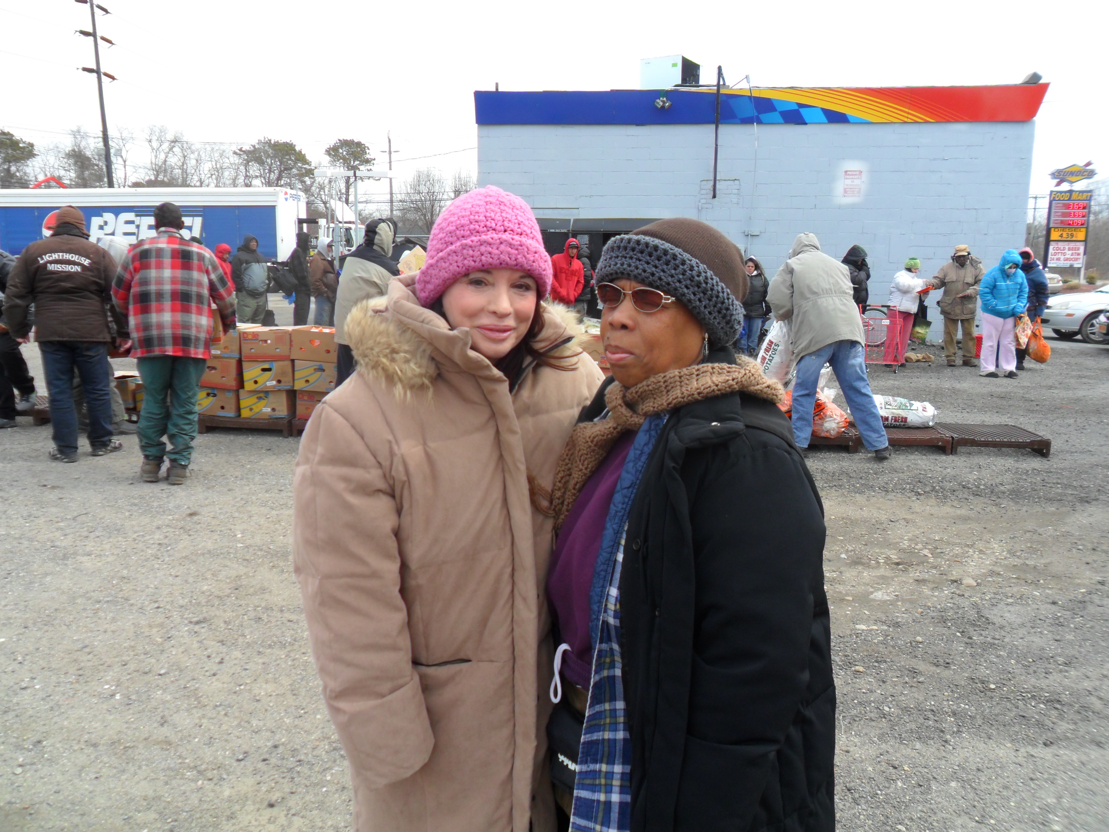 Pastor Sue And Maria Baan giving out food and clothing in Bellport,N.Y.