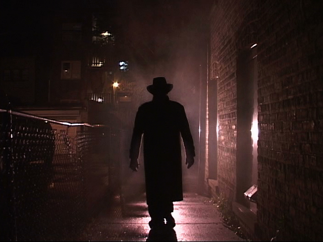 Maurice McNicholas as the FEDORA MAN, in The Lovecraft Syndrome.