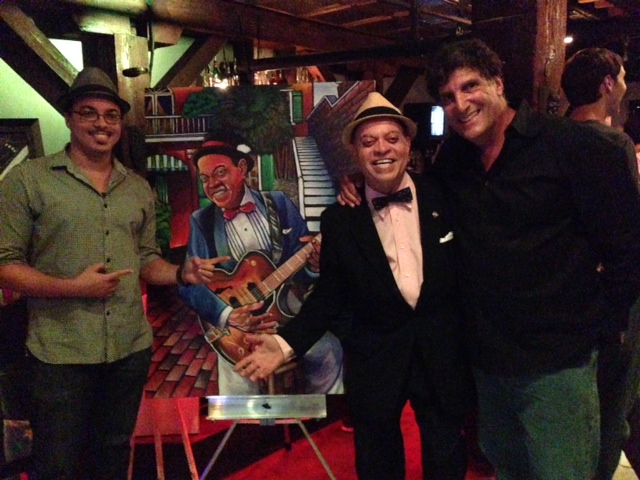 Artist Varion Laraunt, Deacon John, and Steven Scaffidi at the Hit Me America Songwriters Showcase in New Orleans.
