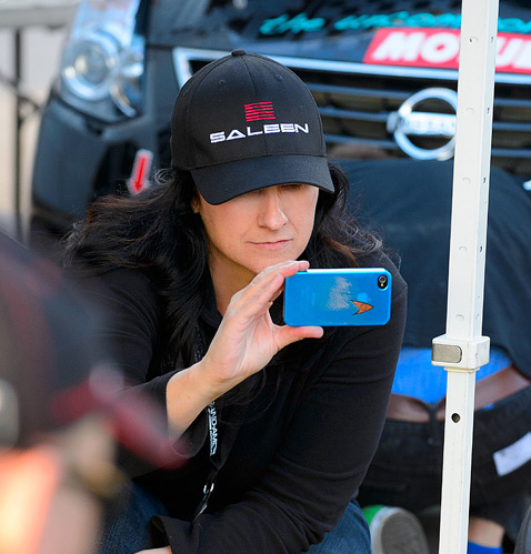 Taking a photo for social media while the Team prepares cars for the race. Skullcandy Team Nissan at Circuit of The Americas, Austin, TX.