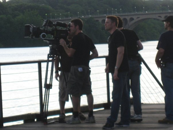 Directing with the Key Bridge and Potomac River in the background. Adam Silver DPing.