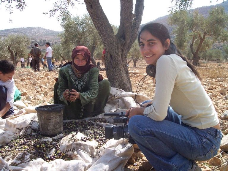 Julia Bacha filming during the olive harvest in the Occupied Palestinian Territories, 2005.