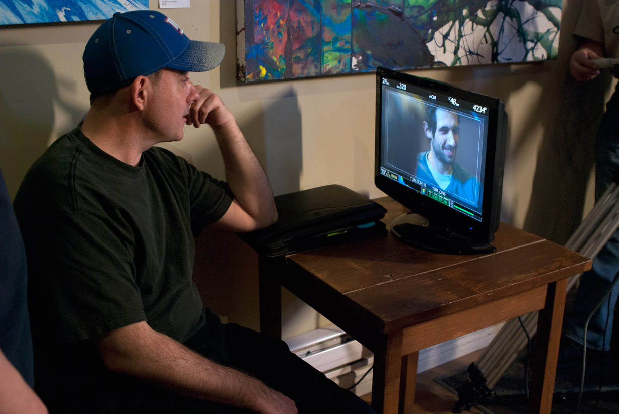 Director DW Gordon examines a take featuring Alessandro Miro, on the set of I Hate Toronto: A Love Story.