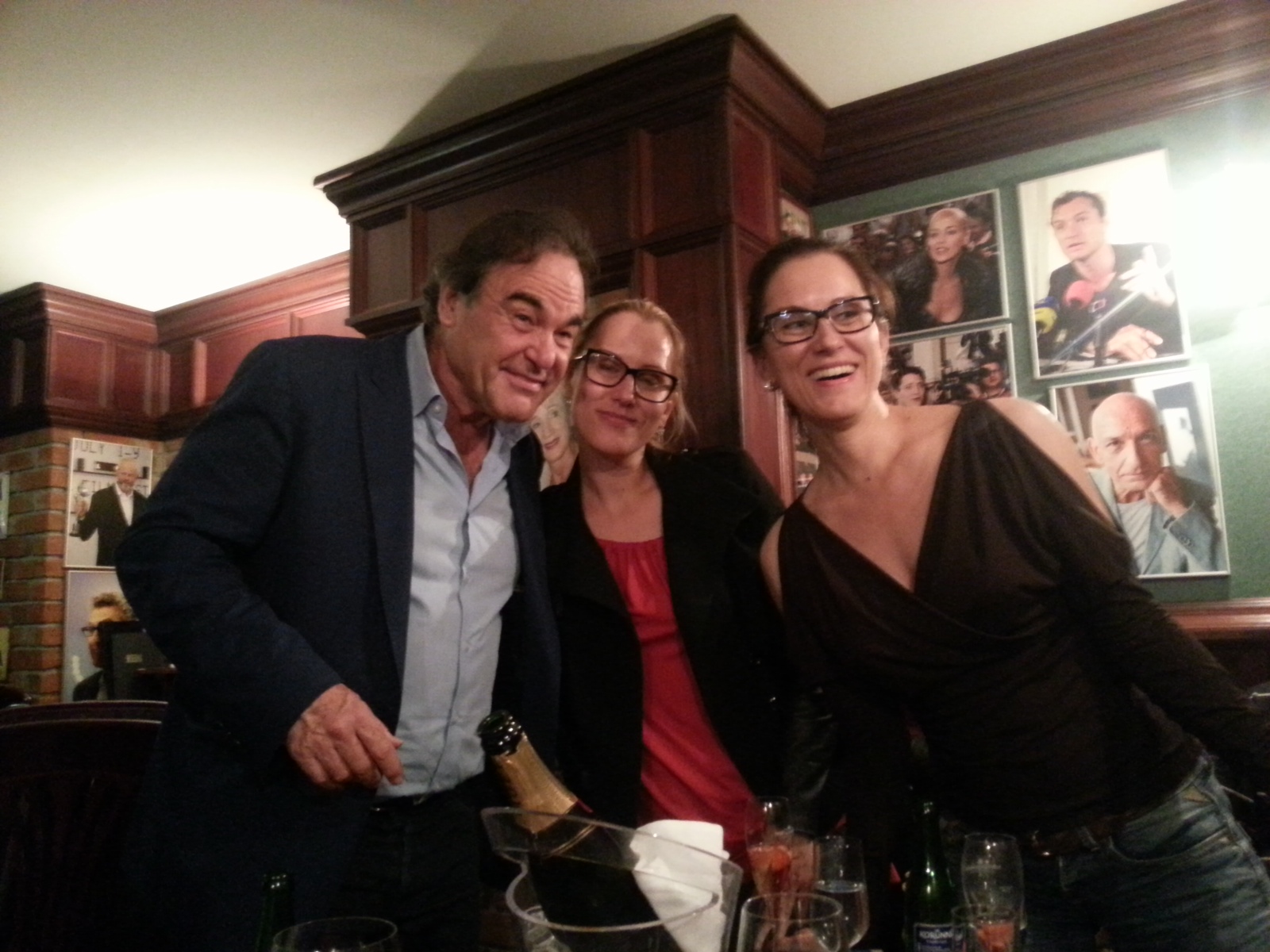 Director Oliver Stone with the producer duo Jitka and Katerina Bartu