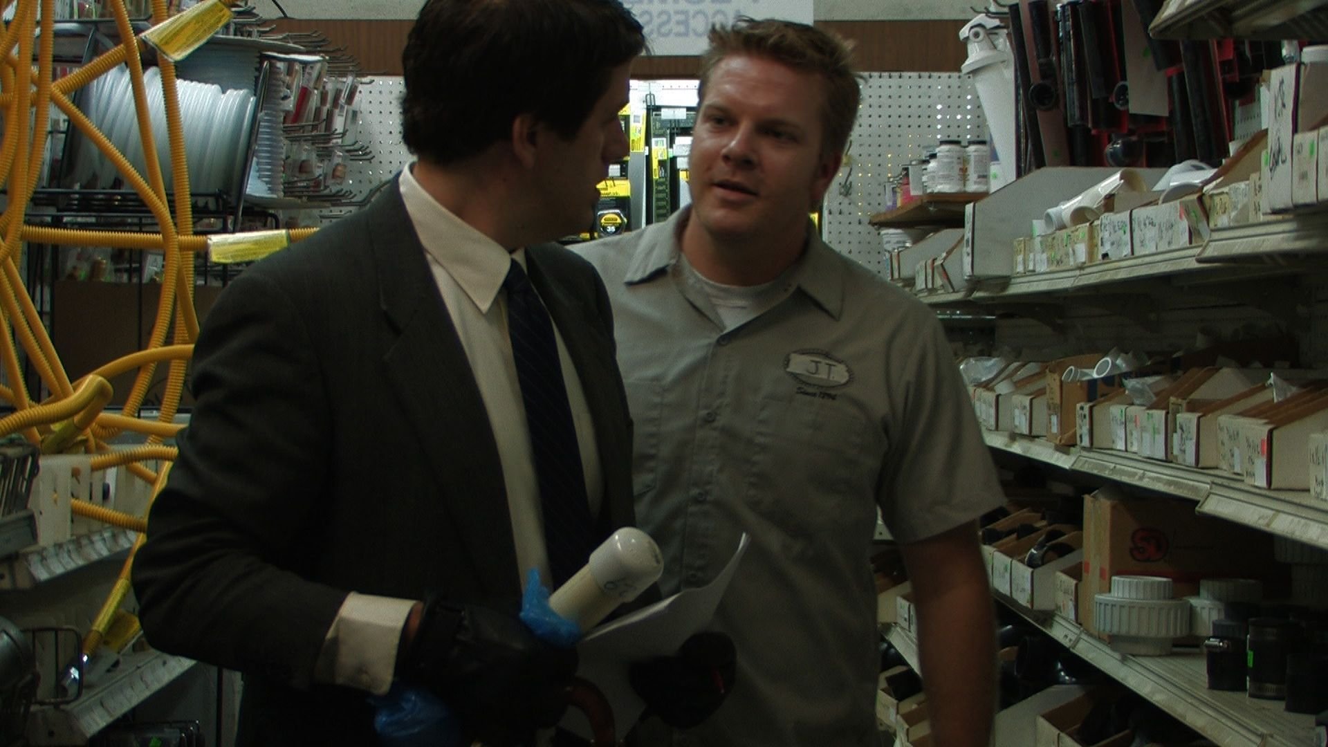 Jack Robinson as Roger and Mike Holley as the Hardware Store Clerk in 