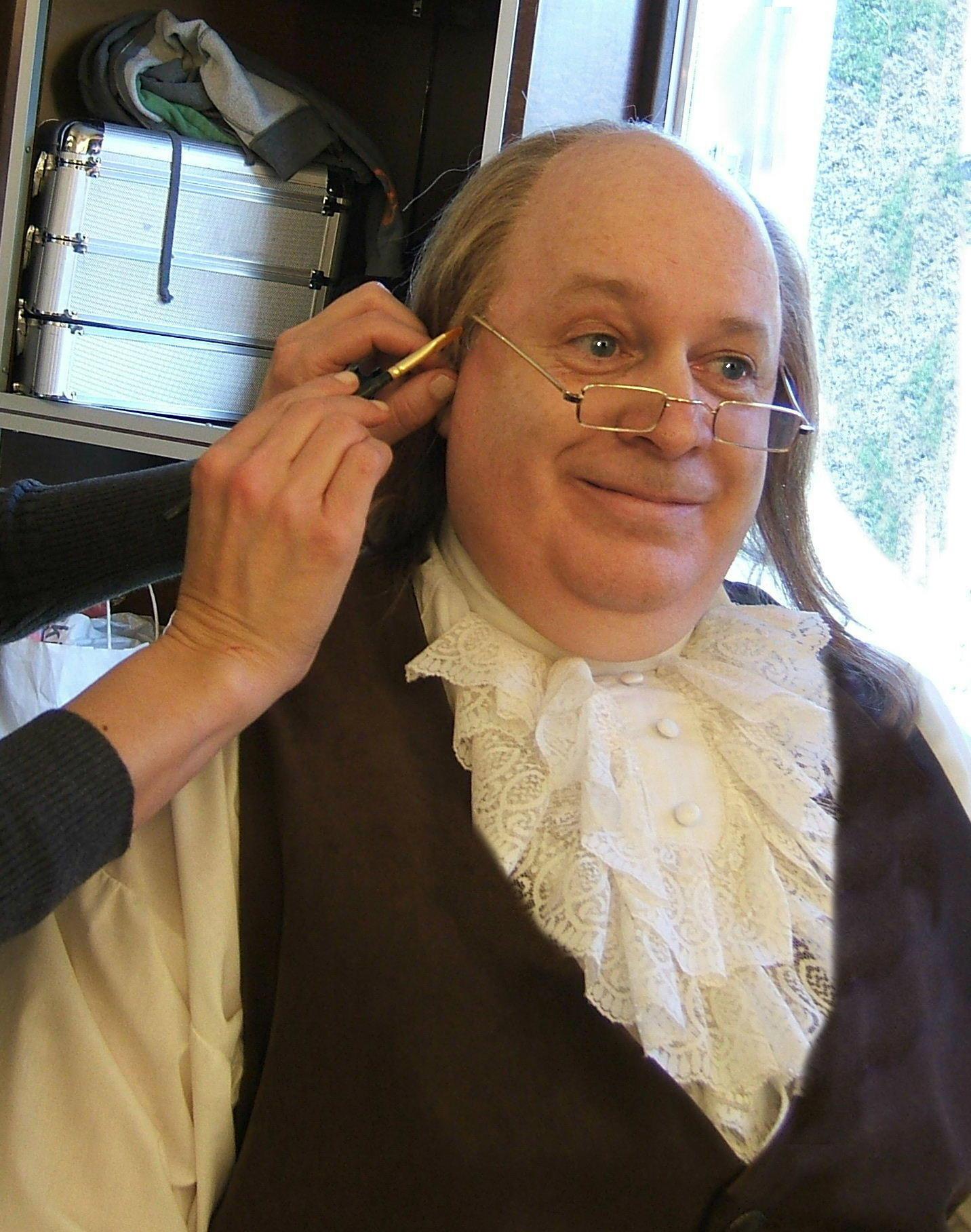 Brian Patrick Mulligan receives one last touch up from top make up artist, Brenna Bash, for his role as Benjamin Franklin.
