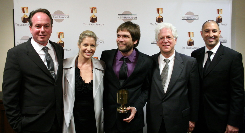 Presenters Tom McGrath and Danny Jacobs surround best commercial winners Gwynne Adik, Uval Nathan, and Ron Diamond (Acme Filmworks)