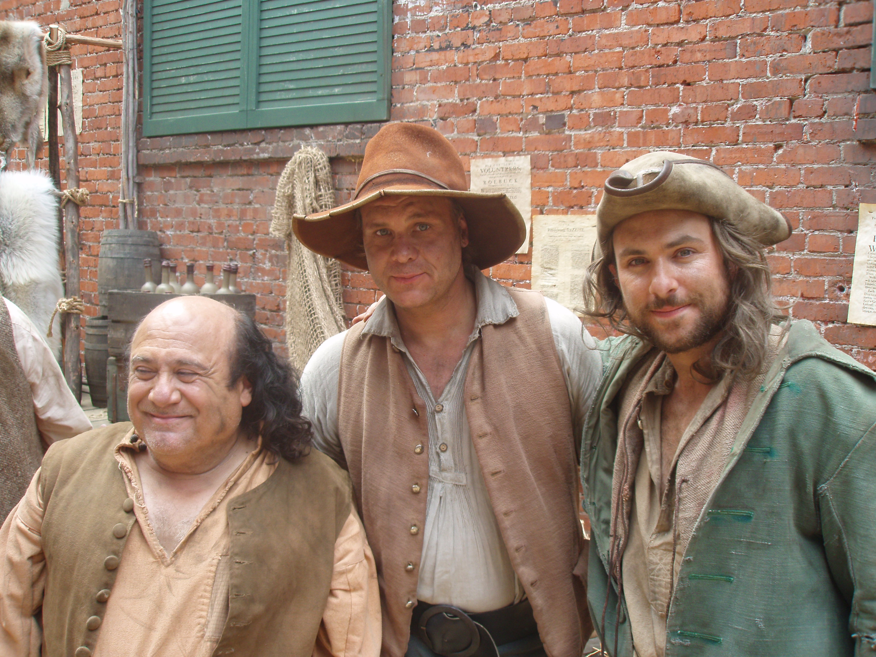 Danny DeVito, Dennis W. Hall and Charlie Day on the set of 