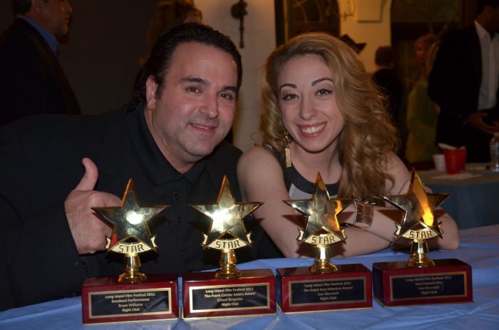 Sam Borowski (L) along with actress Samantha Tuffarelli, display the 4 awards NIGHT CLUB won at the 28th Long Island Film Festival, including Ralph Ince Best Director's Award (Borowski), Frank Currier Best Actor's Award (Ernest Borgnine), Breakout Performance (Bryan Williams) and Best Feature (Producers Sam Borowski, Sam Sherman and J. Todd Smith).