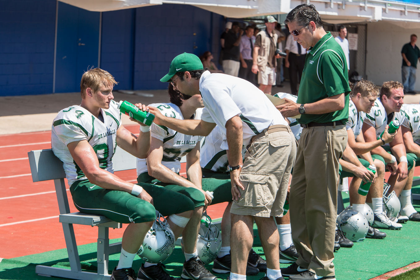 Production still from WHEN THE GAME STANDS TALL w/ Jim Caveziel, Alexander Ludwig, and Matthew Dadarrio.