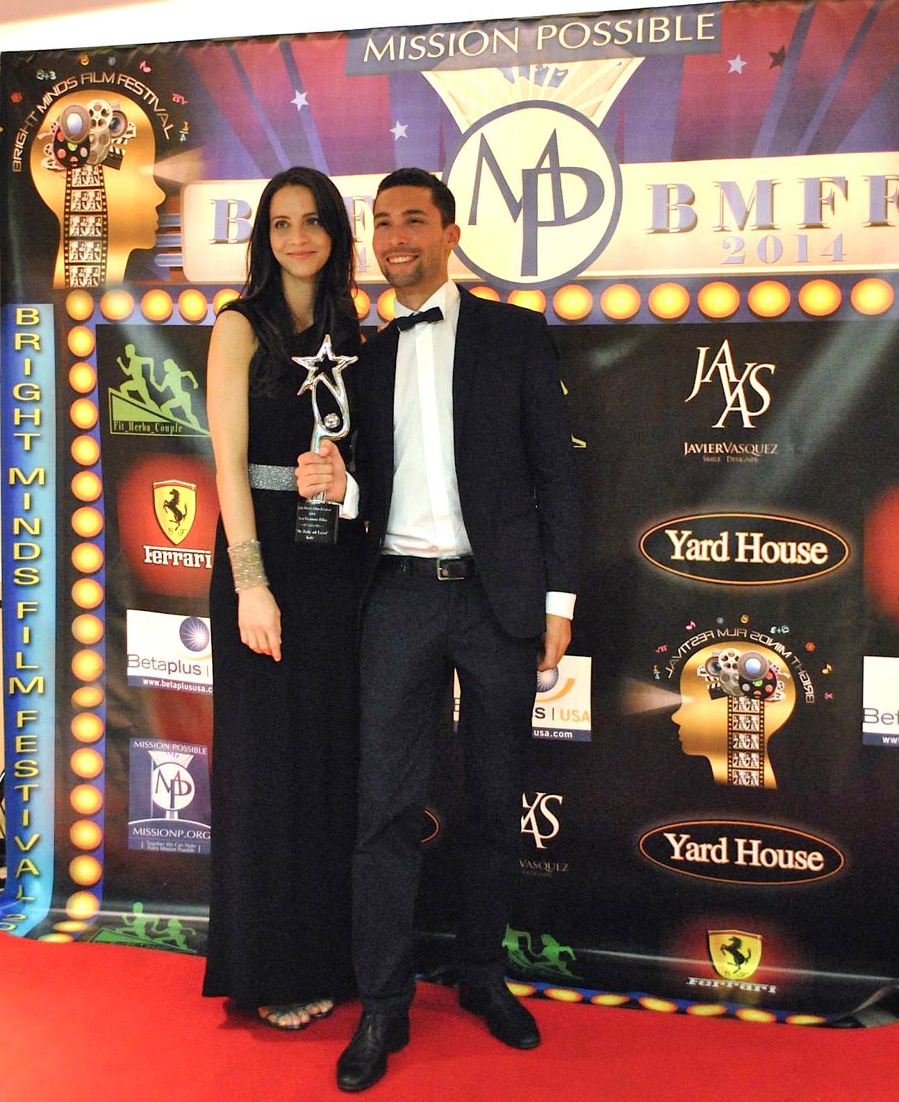 Gledis Cinque and Giacomo Arrigoni receiving Best Feature Film Award at the World Premiere of 