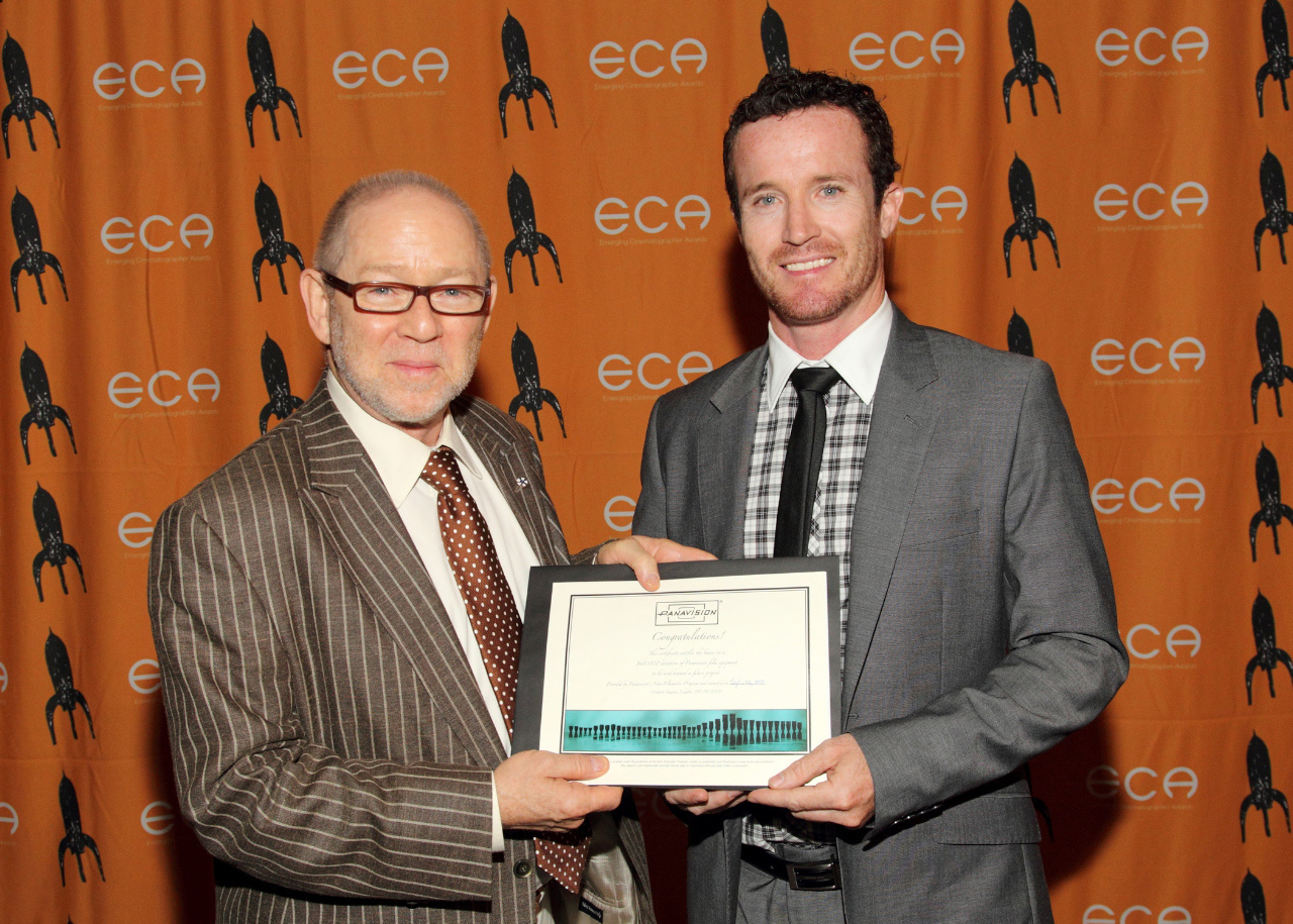 Cameron Duncan receives the Grand Prize Award from Steven Poster at the 2010 ICG Emerging Cinematographers Awards.