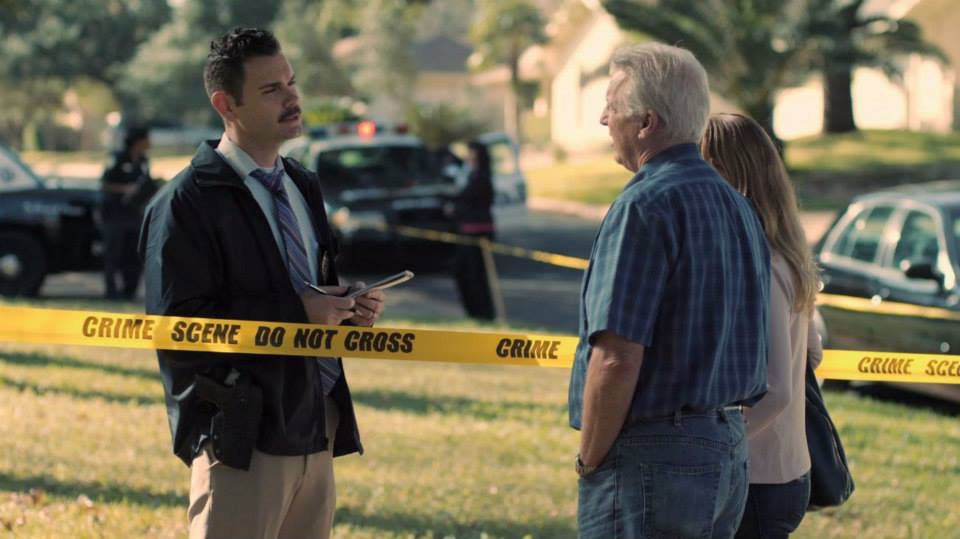 Detective Mike Earl (Jay Moses) questions neighbors on ABC's In An Instant.