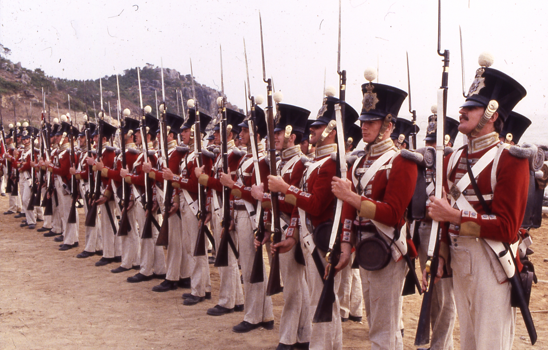 Members of the Cheshire Regiment paying the 26th Foot (Cameronians) Drill instructor/Parade director Tim Pickles Tai-Pan 1986