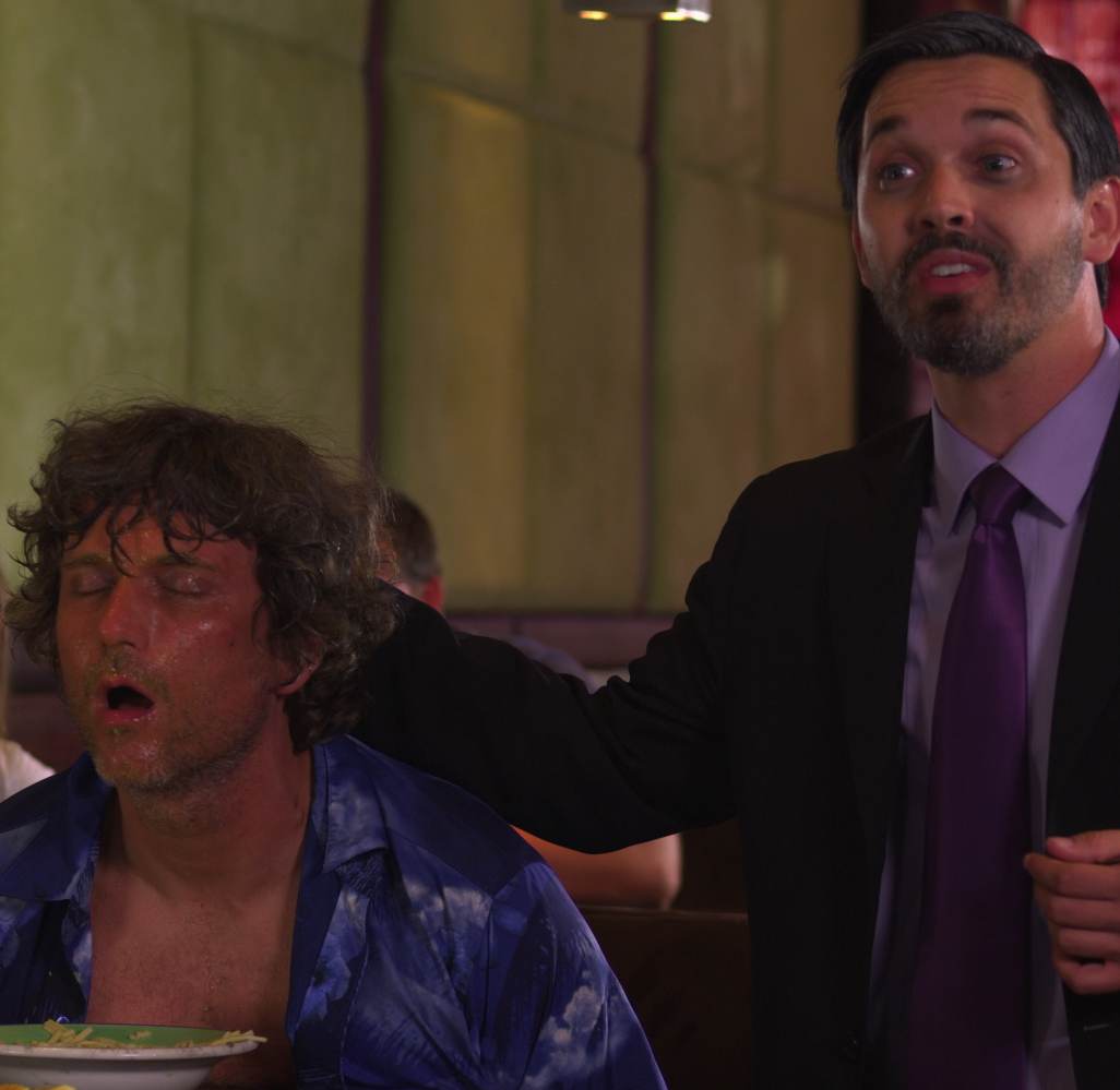 Smythe (Daniel Laney) pulls Steve (Darren Dowler) from his soup - Rock and Roll the Movie