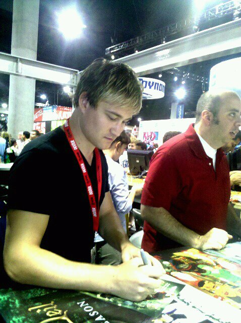 Brendan signing photos for LEGEND OF NEIL at Comic Con 2010