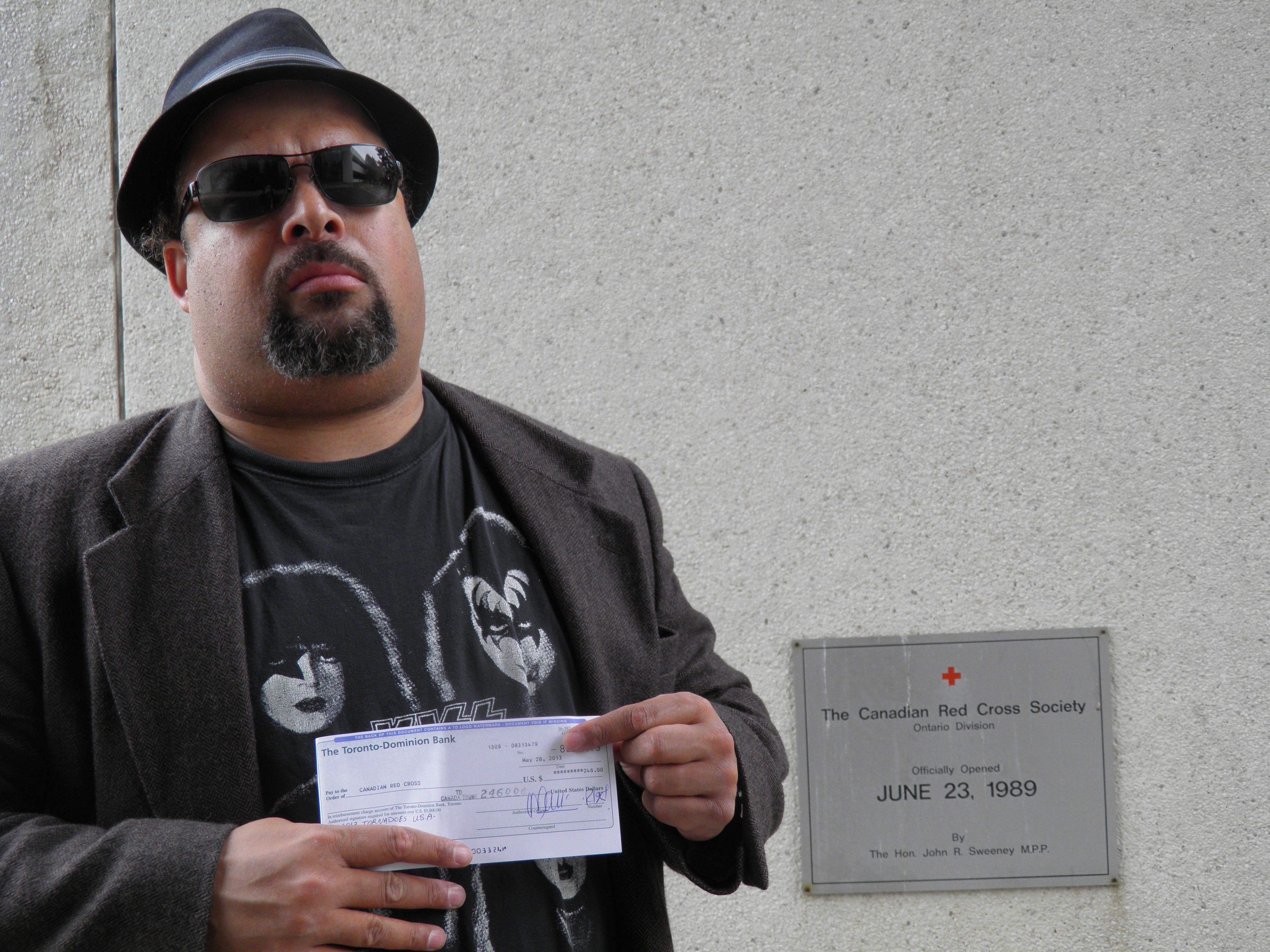 FILMMAKER/ACTOR/CARTTONIST TONY 'TEX' WATT HOLDING RED CROSS $246.00USD MONEY ORDER' FOR '2013 USA MIDWEST TORNADO FUND RELIEF' ON BEHALF OF HIS FACEBOOK & JANGO GROUP MEMBERS FROM THE CONTROVERSIAL 'CHOKE THE CROAK' CONTEST. C/O HTTP://TONYWATT.COM/