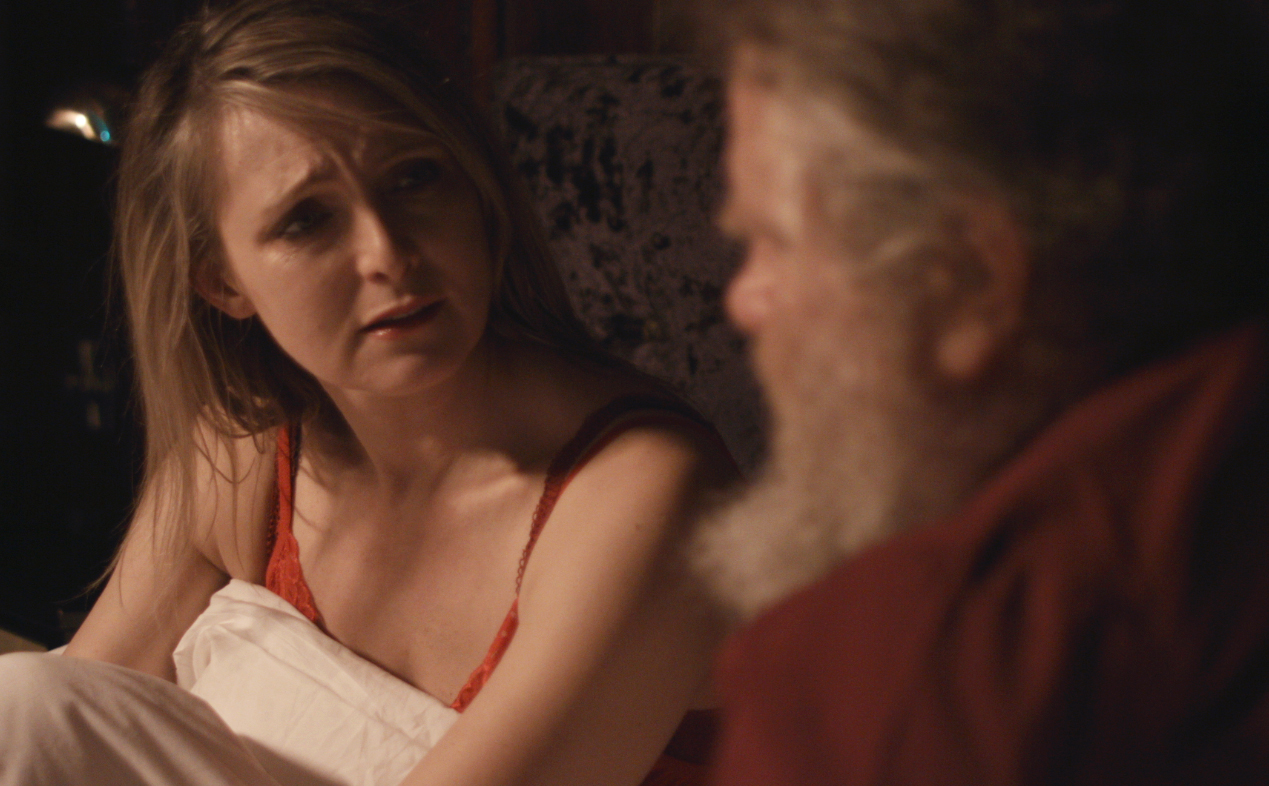 Production still from BIG FAT SANTA, 2014. Marysia Trembecka playing Mrs Santa Claus, Sean Higgs playing Santa Claus