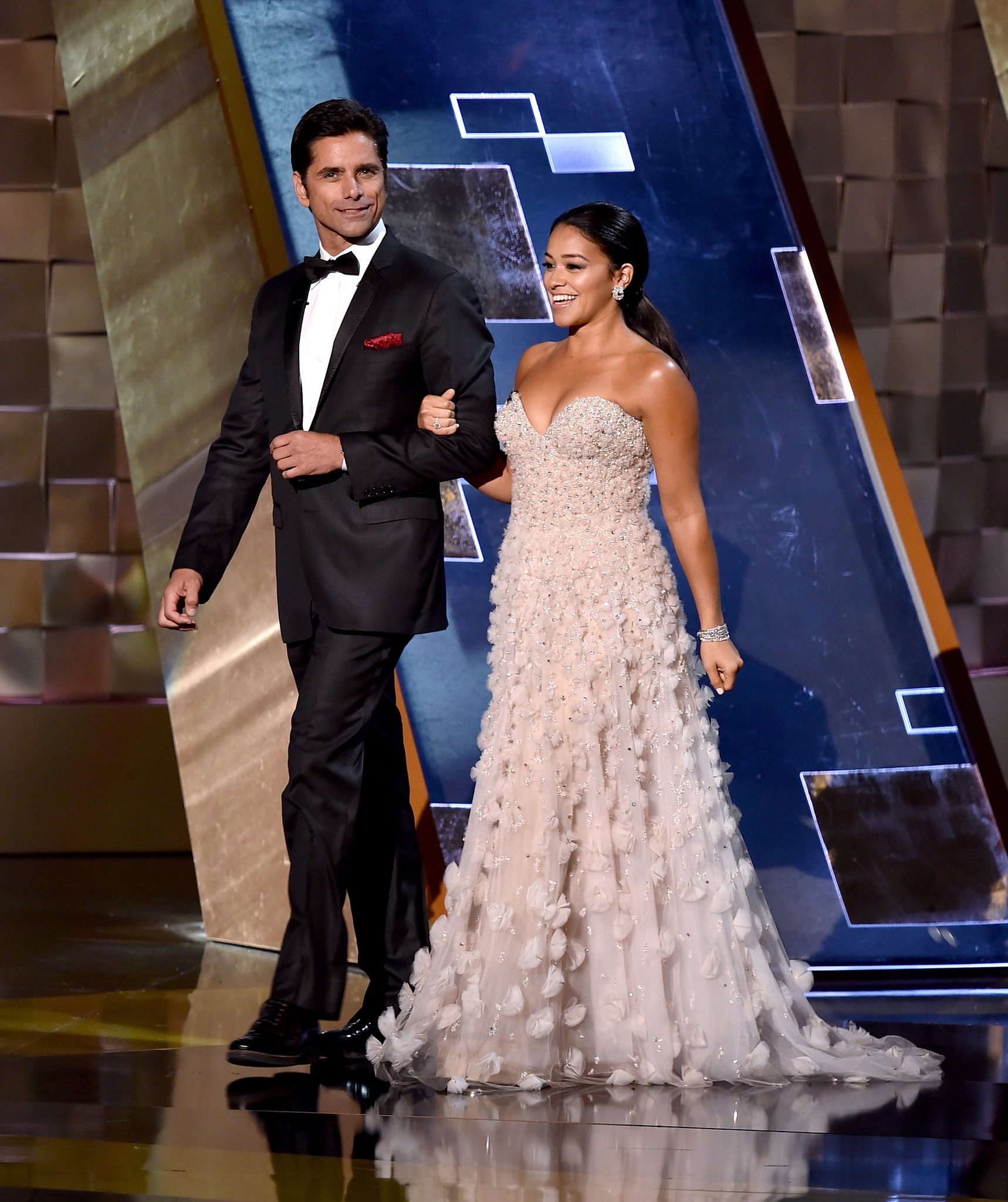 John Stamos and Gina Rodriguez at event of The 67th Primetime Emmy Awards (2015)
