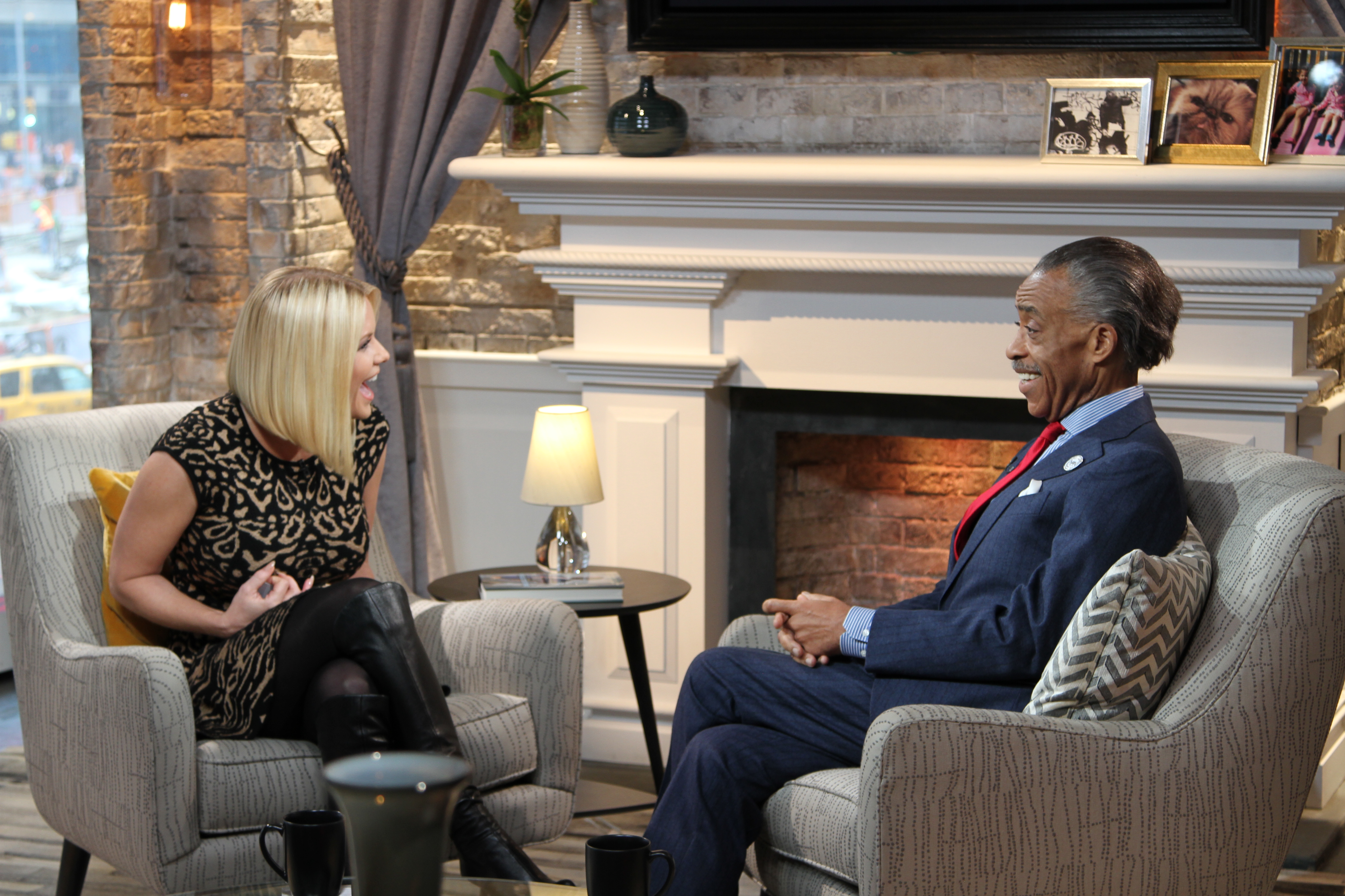 Carrie Keagan with Reverend Al Sharpton on the set of VH1's Big Morning Buzz Live with Carrie Keagan