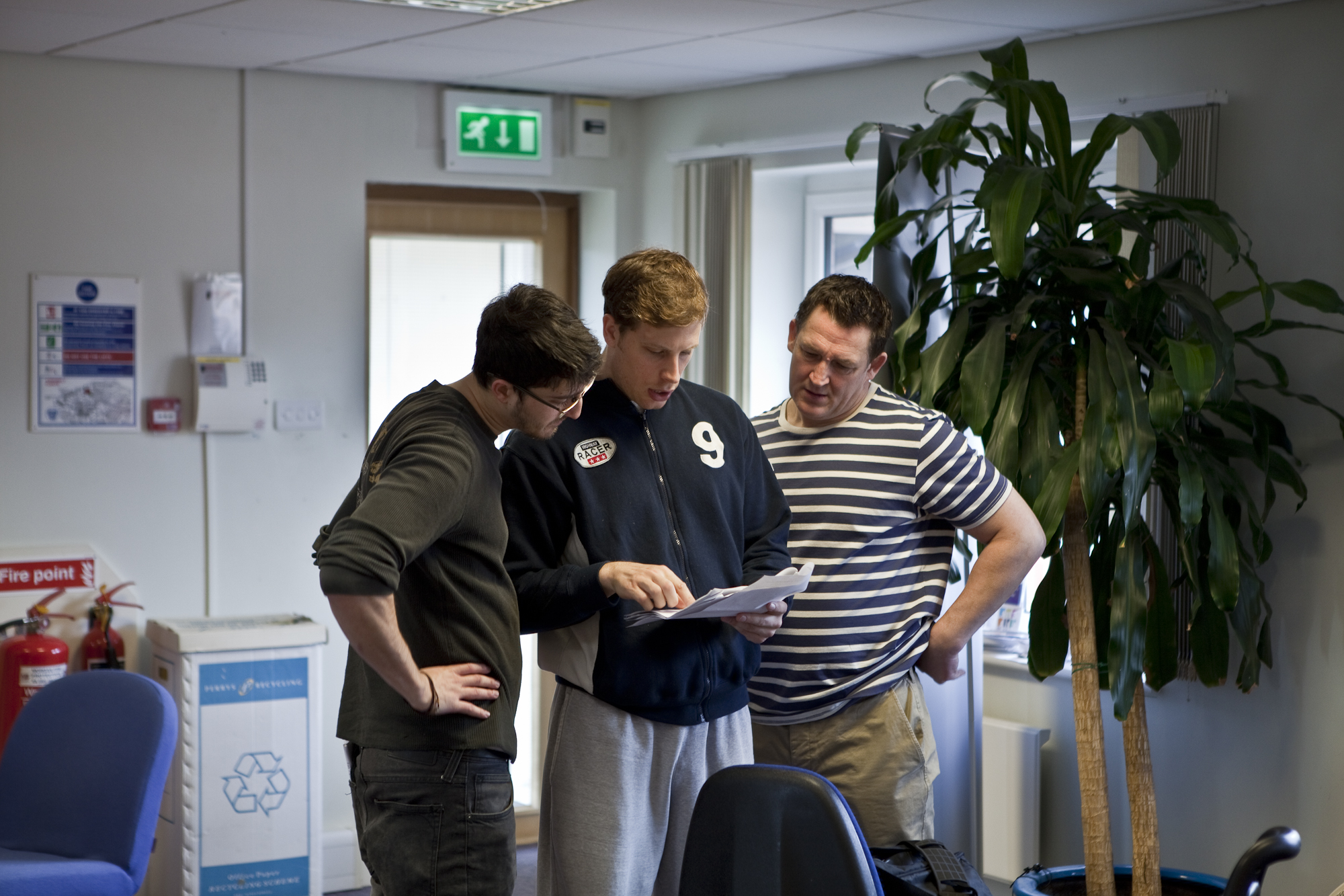 Director Max Lowenbein (left), Sam (middle) and Damien Denny (right) discuss a scene in 