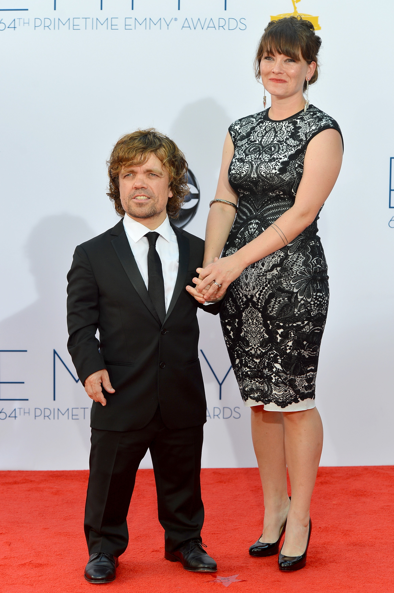 Peter Dinklage and Erica Schmidt at event of The 64th Primetime Emmy Awards (2012)