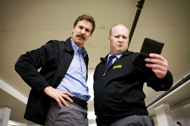 Colby Johannson and Chris Nowland in For Your Security (2008)