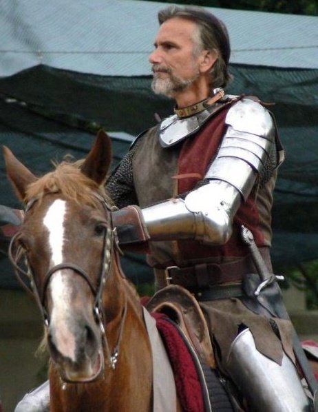 Richard P. Alvarez - on horse and directing a live action joust in performance.