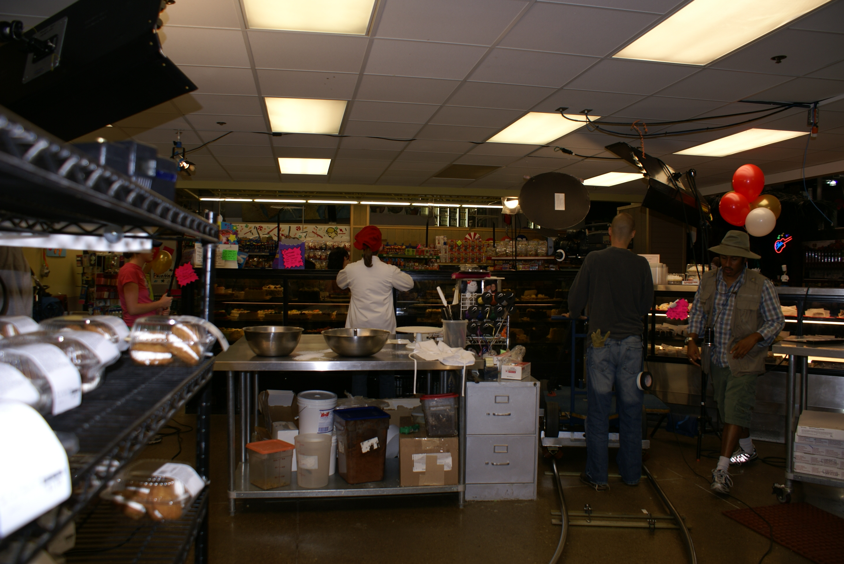 Evan Boymel, Shawn Baird and crew in the bakery on the set of 