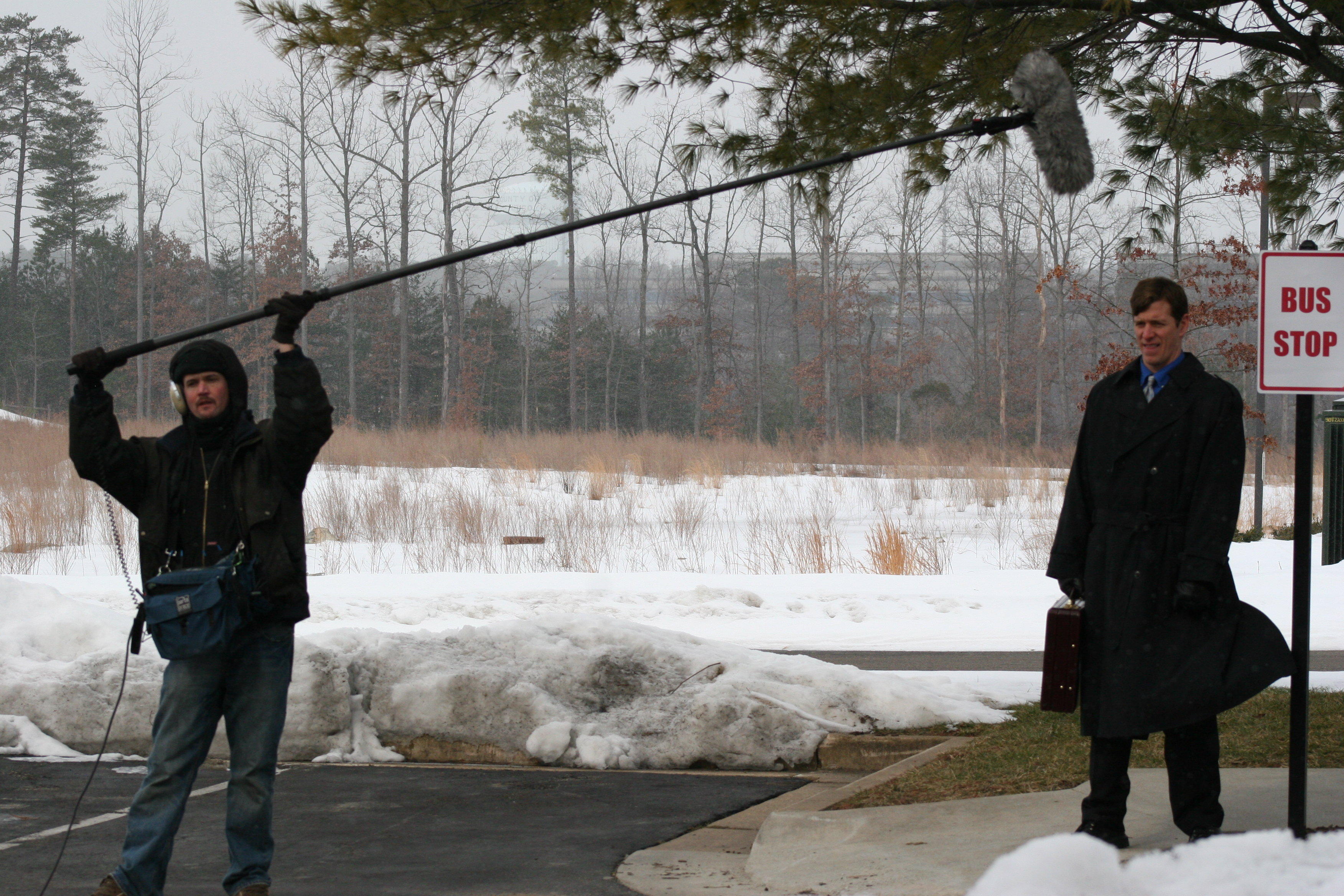 Jeff McGall fights the elements with his boom mic to prepare for the next scene with actor Richard Spencer.