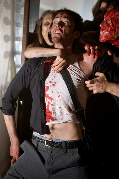 Iggy, played by Zak Kilberg, tries in vain to hold back a zombie attack.