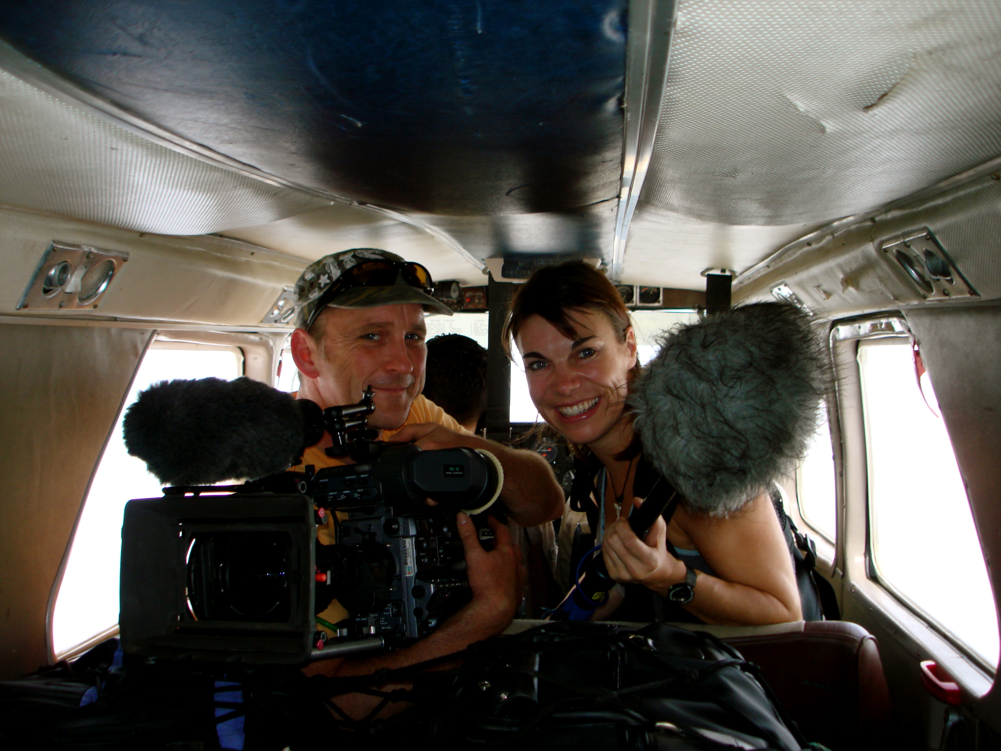 Melanie and cameraman Max on a plane into the Amazon jungle in 2007 to film documentary, 'Tribal Wives' for the BBC.