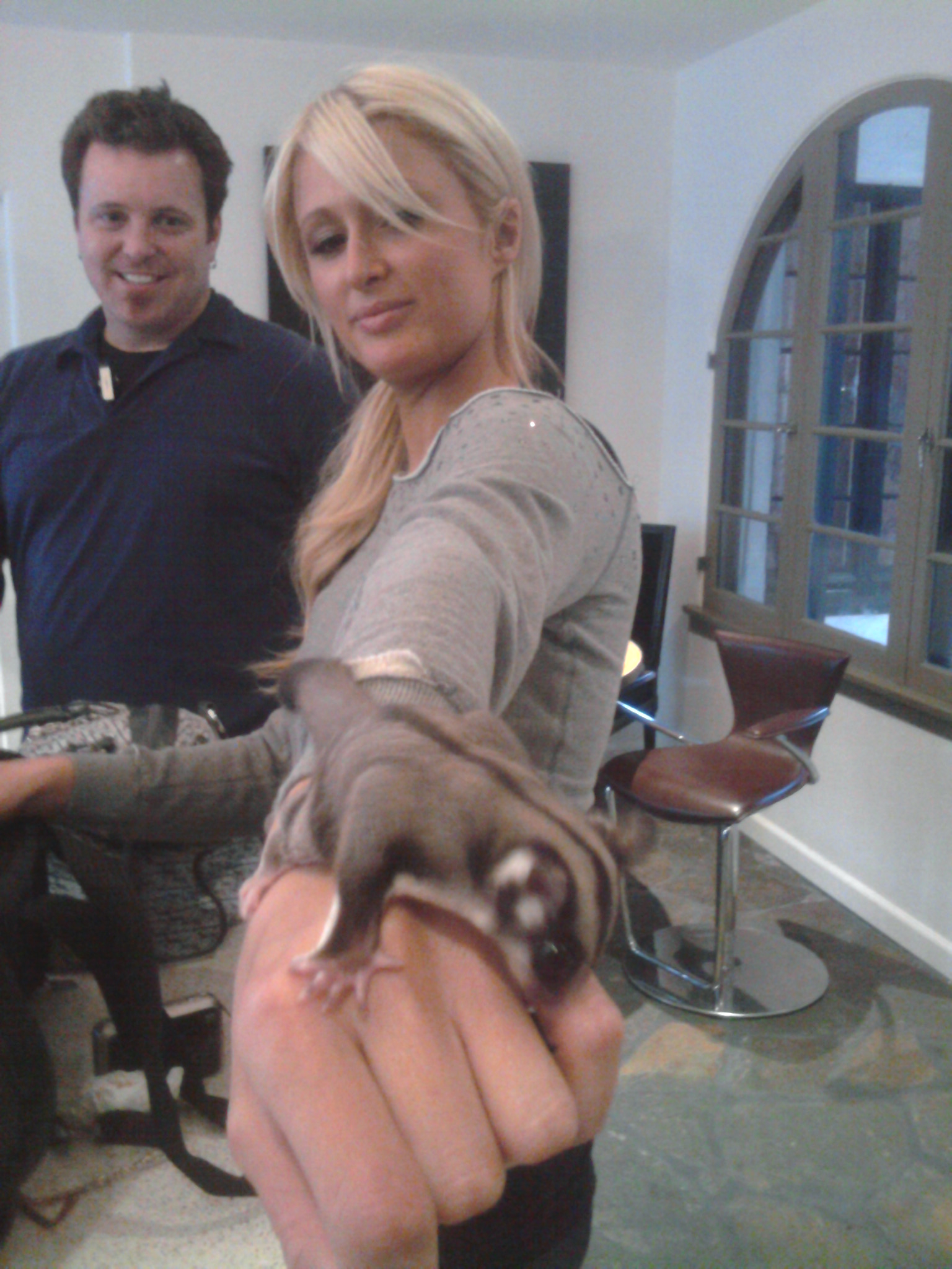 Paris Hilton and The Tim Coston play with Sugar Daddy, the flying squirrel