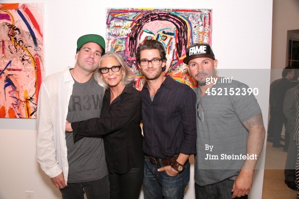 LOS ANGELES - JULY 10: Artist Danny Minnick at his art exhibit poses with Marylin Hassett, Johnny Whitworth, and Fabian Alomar at Gallerie Sparta in Los Angeles, California on July 10, 2014.