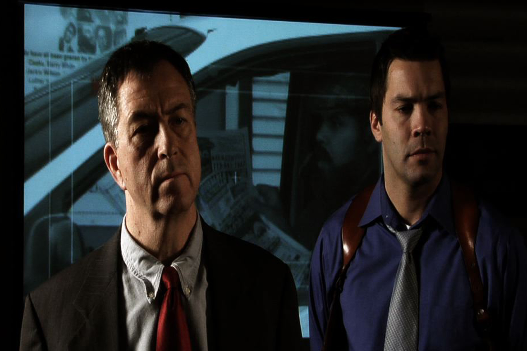 Mark Nilsson (right) as Agent Chase in 4 and a Half Terrorists