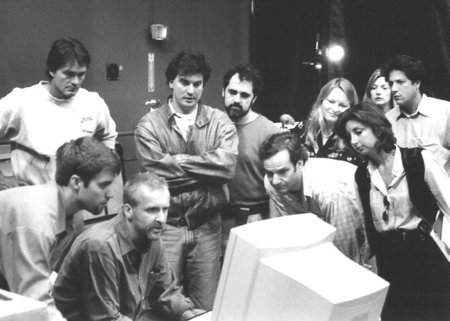 Visual FX crew review 3D motion capture data with James Cameron for Titanic. From bottom left: Brett Gassaway, James Cameron, Daniel Ma and Robert Legato.