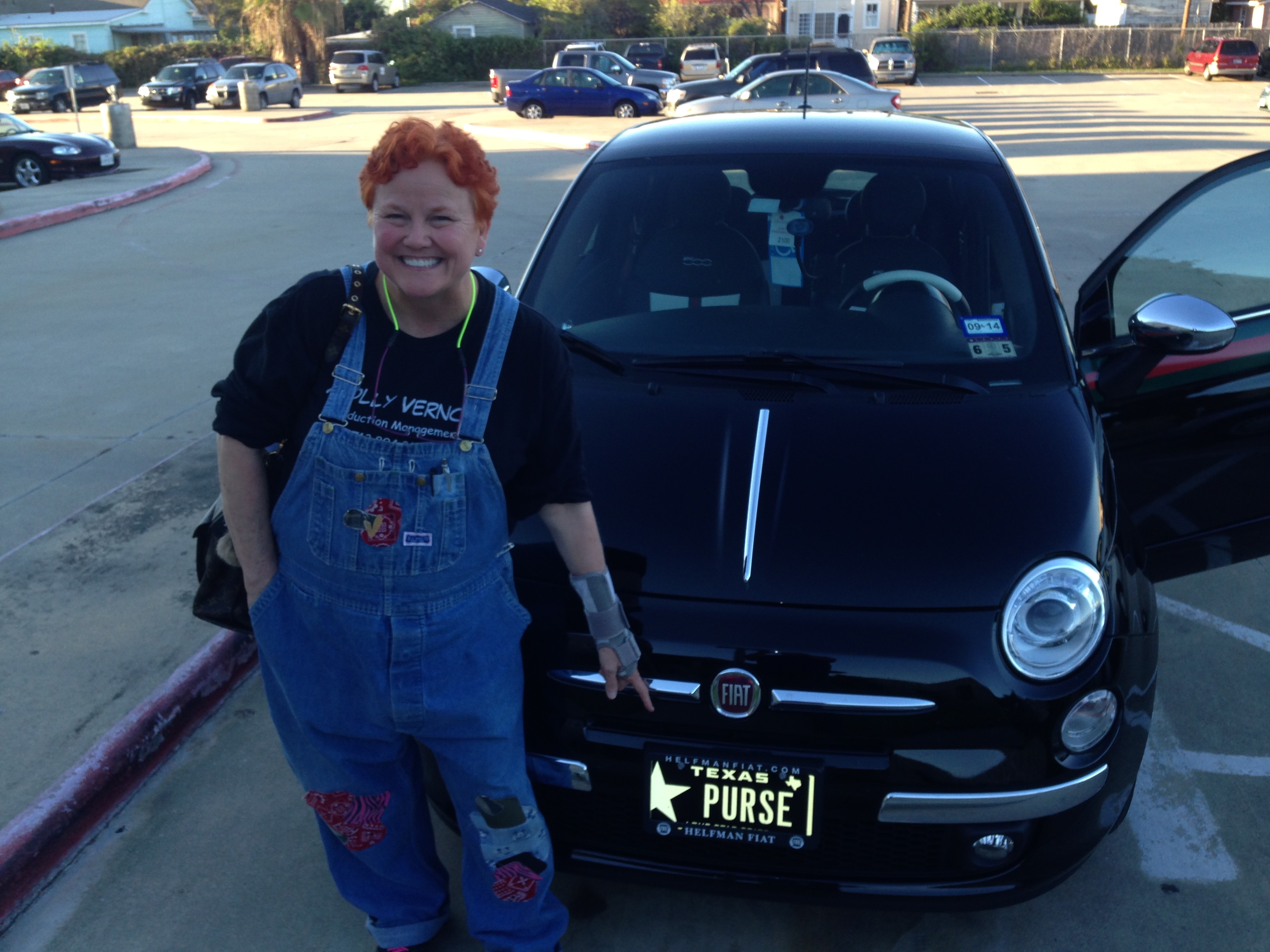 Molly with her GUCCI FIAT and vanity plate purse. Every 1st AD should have one!